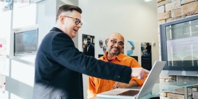 men looking at laptop